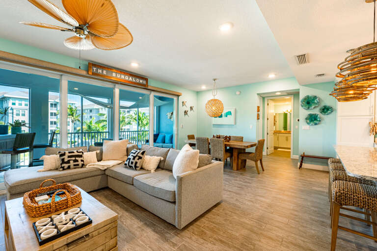 Grab a corner of the open-plan space and you're still part of everything — cooking, dining, and the couch are all in the same conversation.