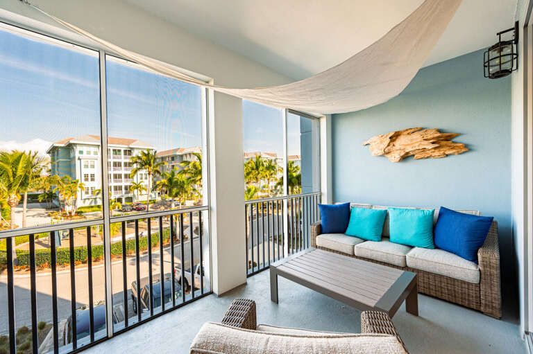 Sink into the balcony sofa with your morning coffee and nowhere to be — palm trees, warm air, and resort views are all yours.