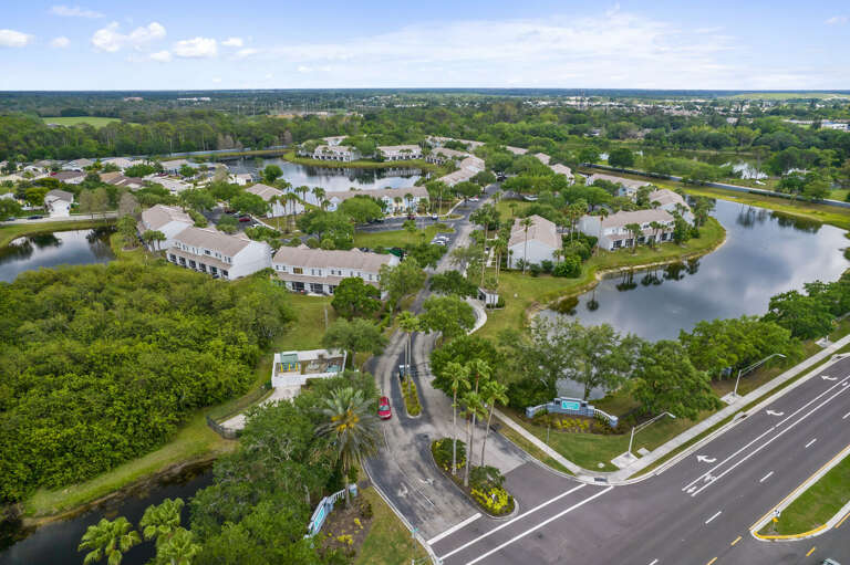 Drift above Sabal Key and see why guests keep coming back — ponds, greenery, and quiet roads all around.
