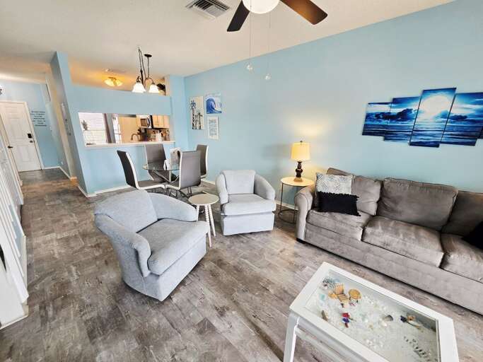 Grab a seat, take in the wave canvas art, and let the open-plan living work its easy Florida magic.