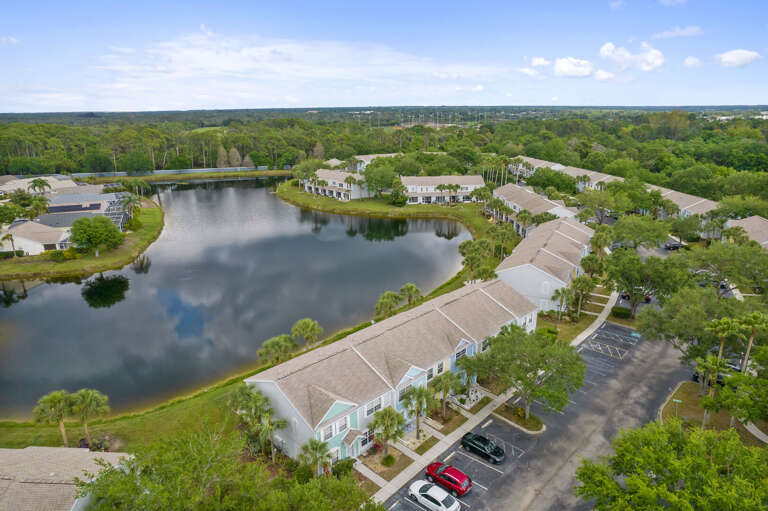 Your townhouse sits right on the pond — look out and find that mirror-still water every morning.