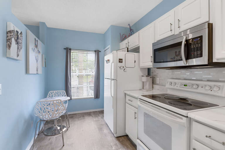 Your white-cabinet kitchen is stocked and ready — bring the groceries and start cooking tonight.