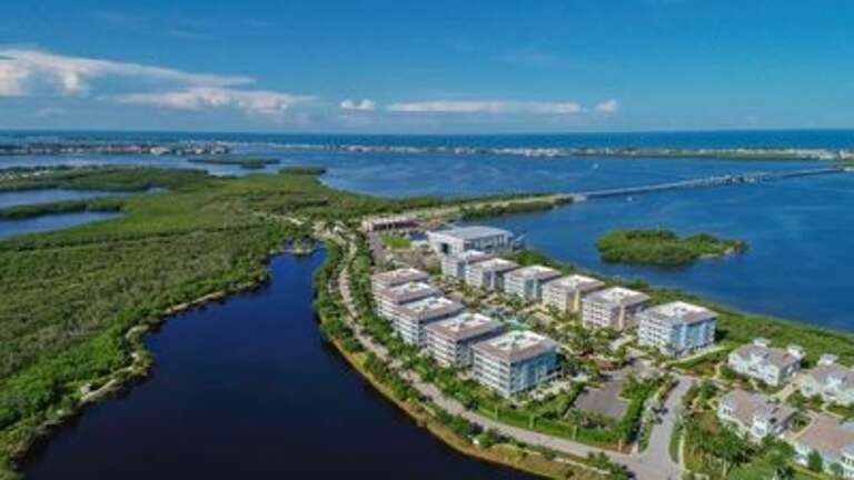 This location offers quick access over the bridge by car, bike or walking about 1 mile to AMI where