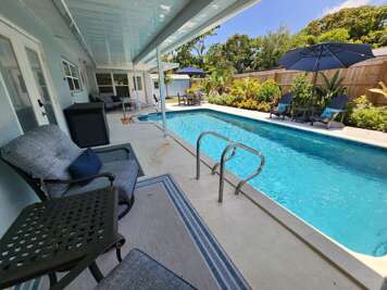 Claim your lounger, drop the drinks cooler, and let the Florida afternoon stretch out. The heated pool is all yours — no sharing, no resort crowds, just tropical landscaping and open sky.