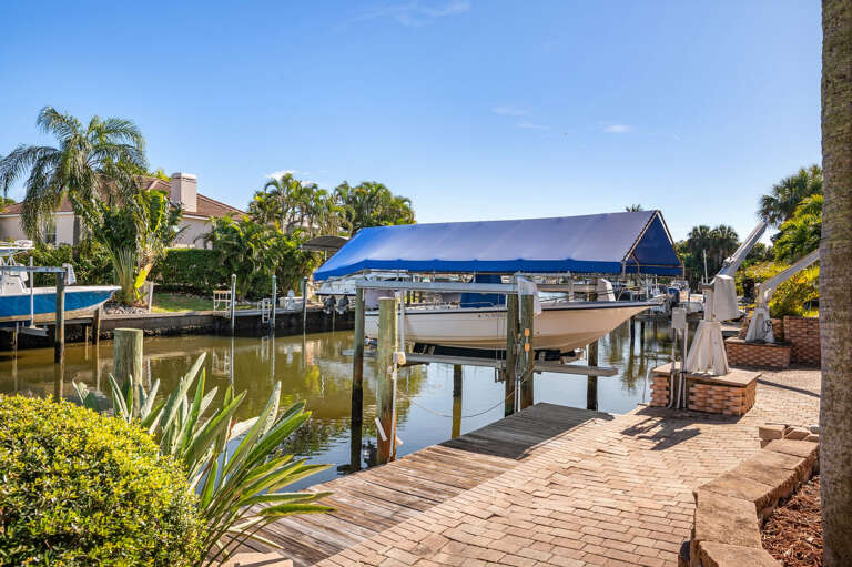 Drop a line, tie up your boat, or just float here watching the water — your private canal dock is steps from the pool.