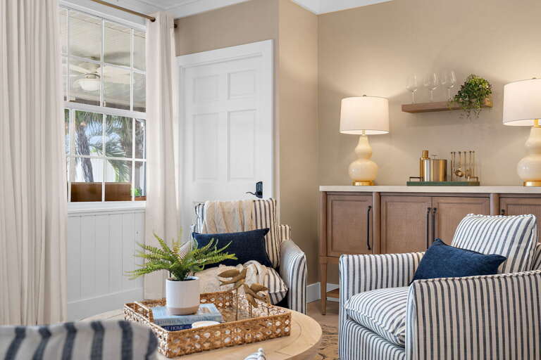 Pull one of these chairs to the window and read for an hour while the rest of the house runs at full speed — this little nook stays consistently calm no matter what is happening in the kitchen.