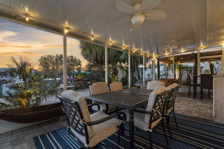 Set dinner outside and let the sunset light do the decorating — string lights, a warm sky, and a table big enough for everyone means no reason to eat indoors all week.