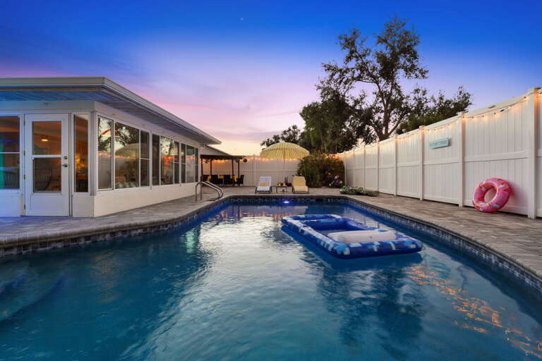 Float the evening away! Soft dusk hues and gentle pool lighting set the mood for a relaxing night swim.