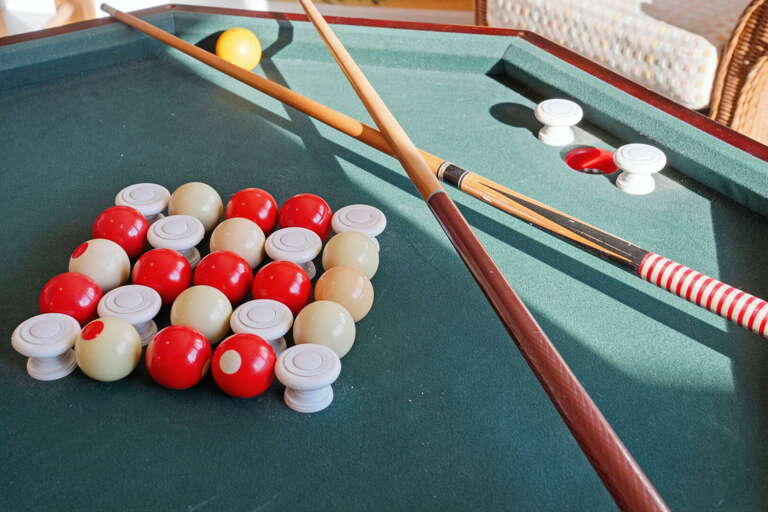 Grab a cue anytime — the billiards table stays racked and ready all week, no setup required.