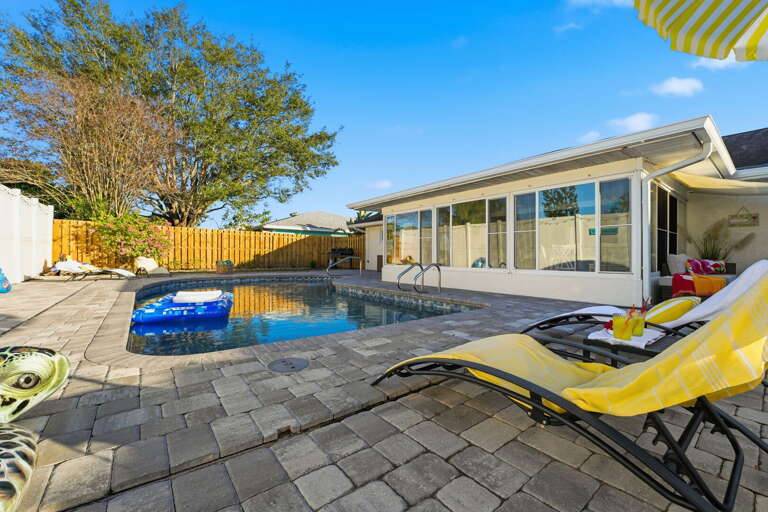Grab a seat in the sun! Comfy loungers, cool drinks, and sparkling blue water — this is vacation mode, activated.
