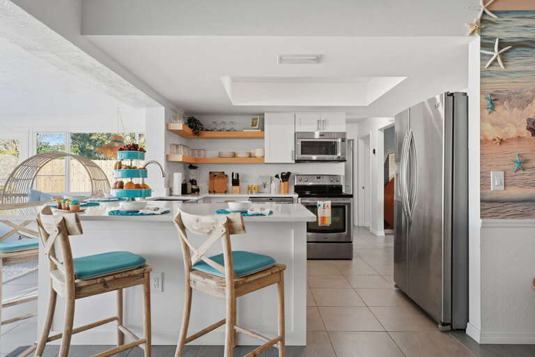 Pull the whole group to the table for dinner, or just grab a stool and watch the pool from here over morning coffee.