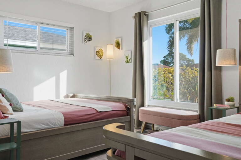 Tucked-in comfort! Soft linens, garden views, and playful tropical touches make this queen room a favorite for little ones and grown-ups alike.