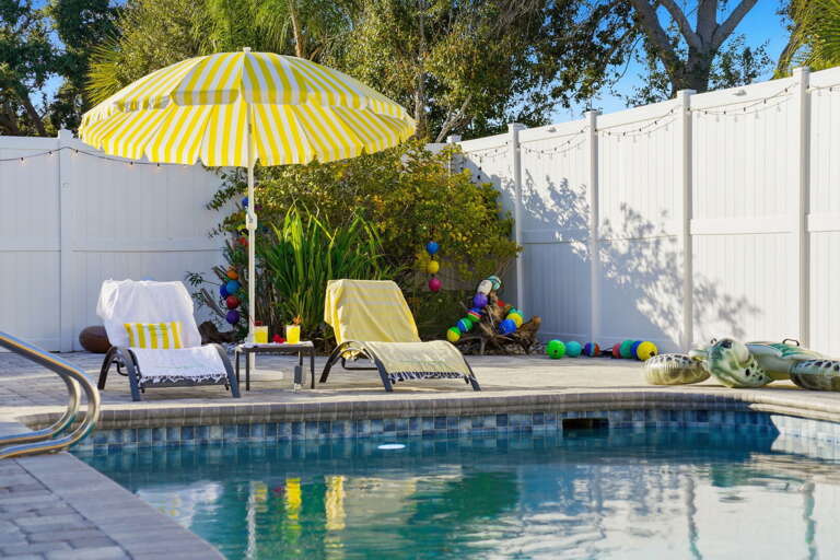 Yellow stripes, blue water, zero worries — your lounge chair is waiting