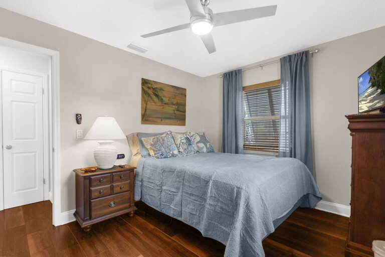 Drift off with the ceiling fan running and wake up whenever you're ready — this room has everything you need and nothing you don't.