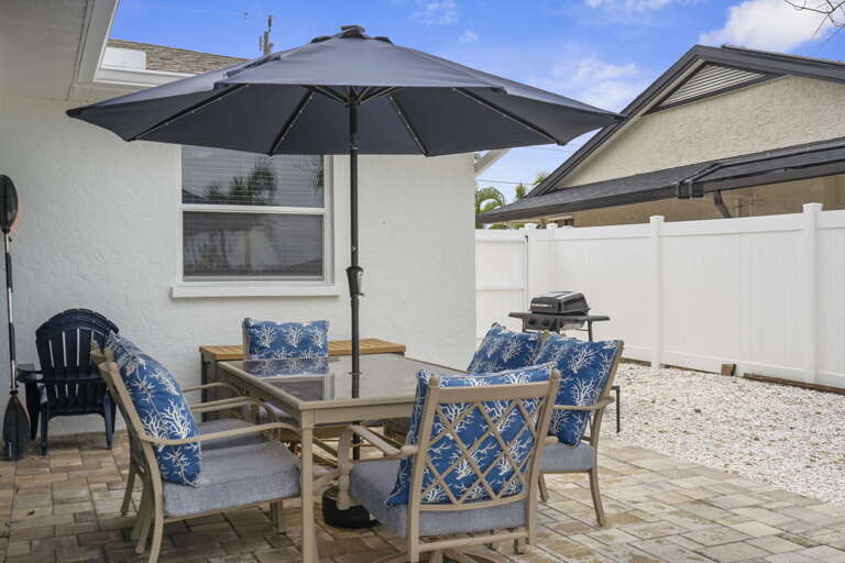 Fire up the grill, pull six chairs around the table, and let your evening stretch as long as it wants — canal right there, cold drinks optional.