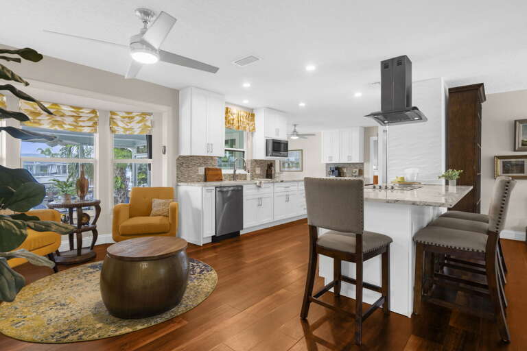 Open floor plan means your group is never split up — the living area flows right into the kitchen and out to the lanai without any walls in the way.