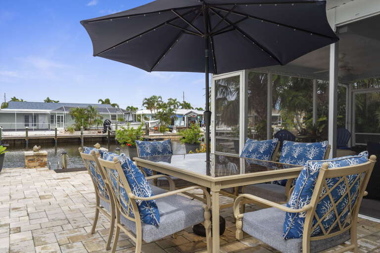 Pull up a chair at your patio table and decide — morning coffee looking at the canal, or evening wine watching the dock lights come on.