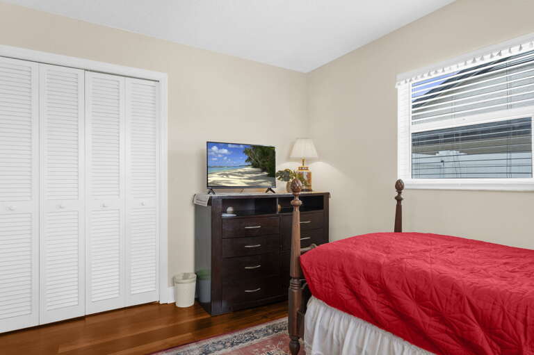 Unpack into the full dresser, flip on the TV, and settle in for your stay — the twin room is a real bedroom, not an afterthought.
