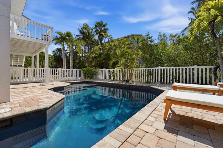Float in a private pool with nothing overhead but palms and blue sky — this is exactly what you booked the trip for.