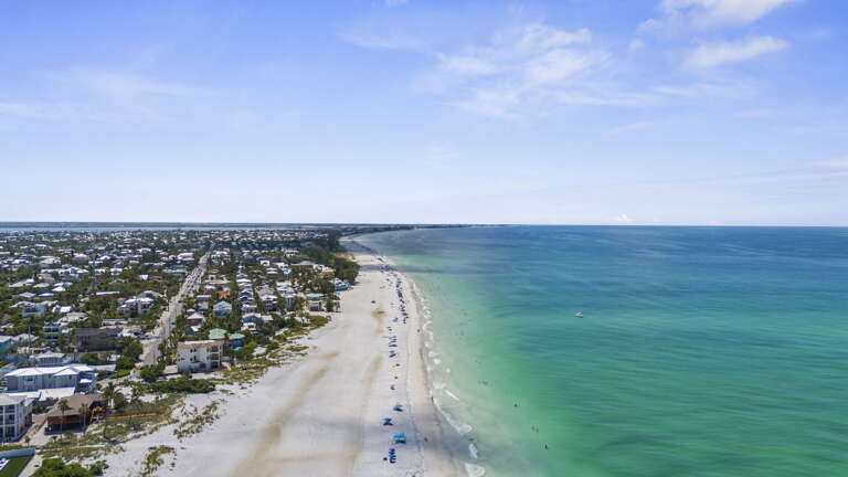 Take in miles of white sand beach and turquoise Gulf water stretching along the whole island — it's all yours to explore.