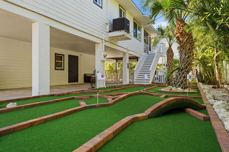 Play a round on your private 8-hole mini golf course — surrounded by tropical palms and perfect for friendly competition after a beach day.