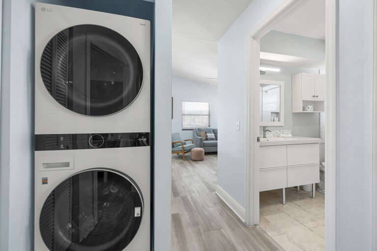 Run a load of beach clothes between days out — the stacked washer-dryer handles it, and clean towels are ready before morning.