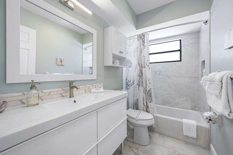 Soak in the tub after a long beach day, or rinse off and get back out there — either way, the tub-shower combo covers you.