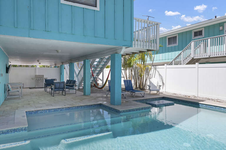 Walk out to the pool deck and you've got the hammock, the grill, the hot tub, and the lounge chairs all within reach.