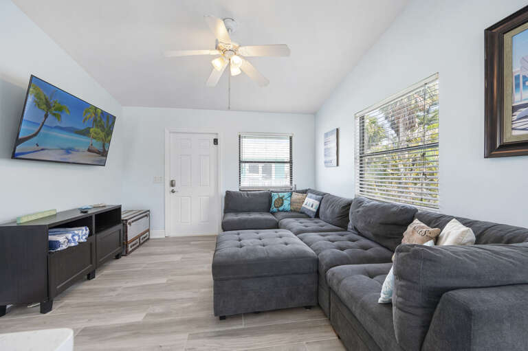 Drop onto the sectional, flip on the TV, and start the evening. There's room here for the whole group — nobody's stuck on a dining chair.