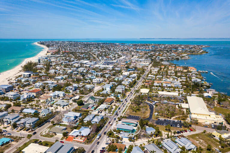 Find your place on the island from up here — Gulf beach on your left, the bay on your right, your vacation house right in the middle. Two hundred steps to the sand.