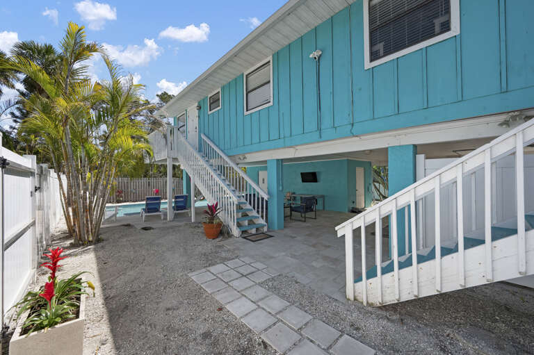 Picture the flow before you arrive — staircase up to your unit, pool deck below, covered patio at ground level. It all clicks once you see it.
