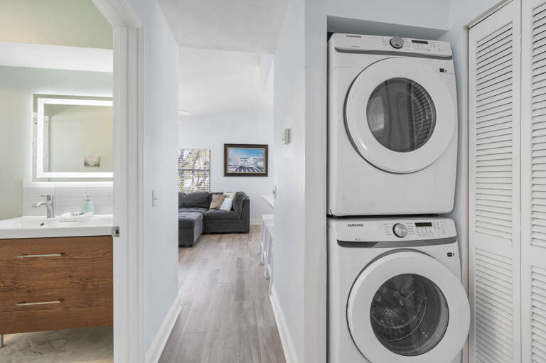 Run a load between beach visits so you're not packing dirty clothes home — in-unit washer and dryer right in the hallway closet.