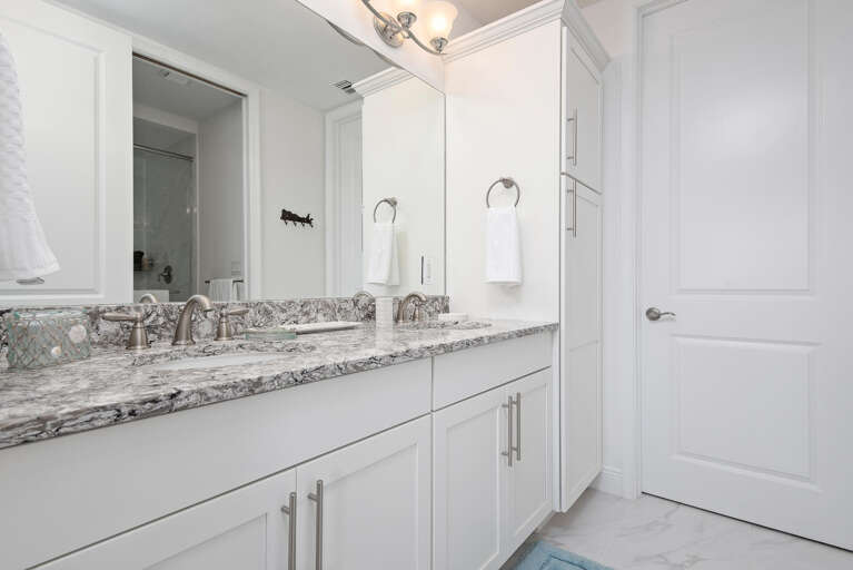 Refresh in the master bath after a full day on the water — bright, clean, and stocked with everything you need.