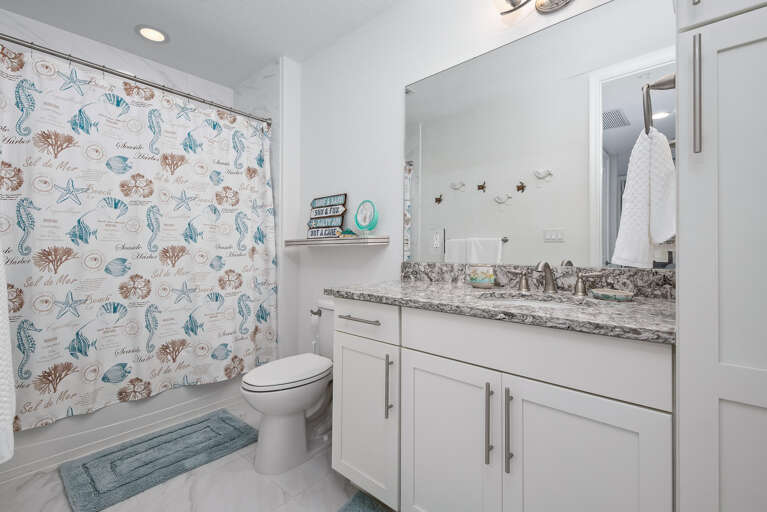 Use the shared third bathroom to keep the whole group moving — clean, accessible, right off the main hallway.