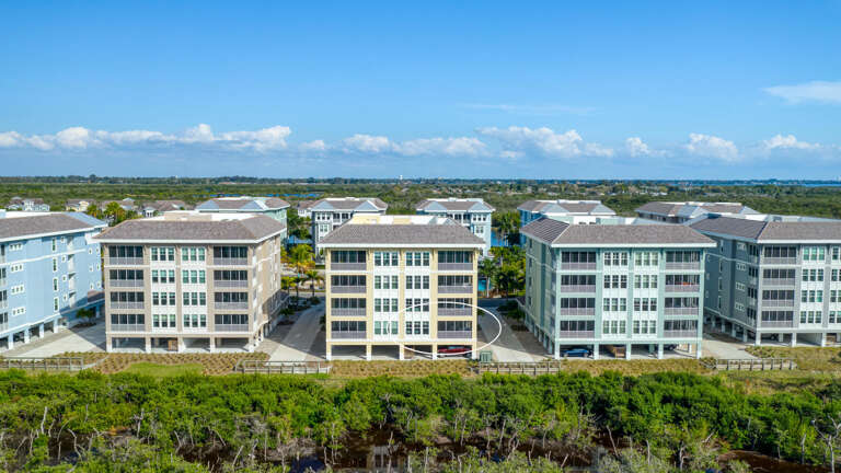 Walk out to landscaped grounds at the water's edge — the bay vista is right outside your complex.