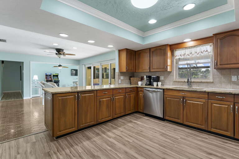 Cook with one eye on the kitchen, one eye on the game room — open sightlines mean you never miss the action.