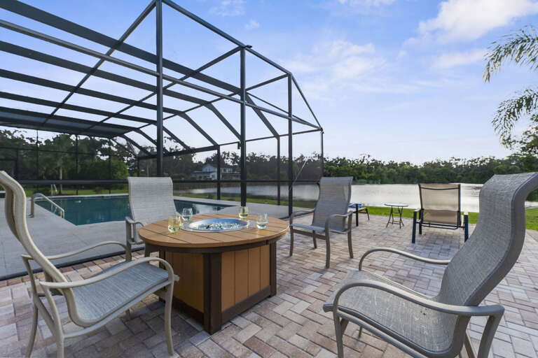 Light the poolside fire pit, pull a chair over, watch the sunset turn the lake orange.