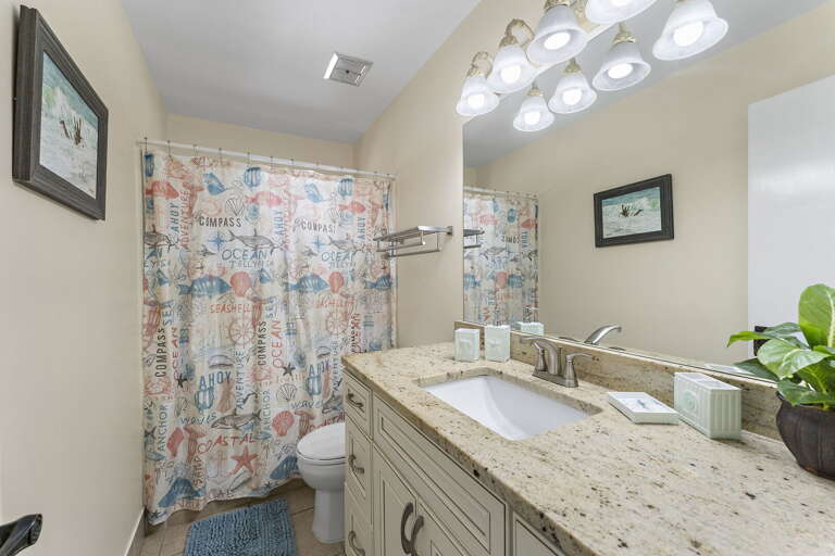 Share the granite vanity and nobody waits — toothbrushes side by side, mornings run smoother.