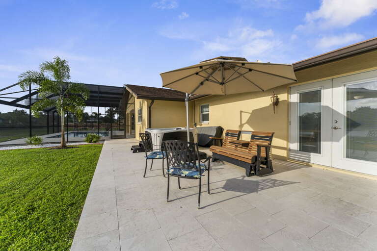 Sit under the cantilever umbrella with the lake yards away — this becomes your read-a-book corner of the trip.