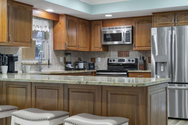 Stock the stainless fridge on day one and feed the whole crew for the week — plenty of room for everyone.