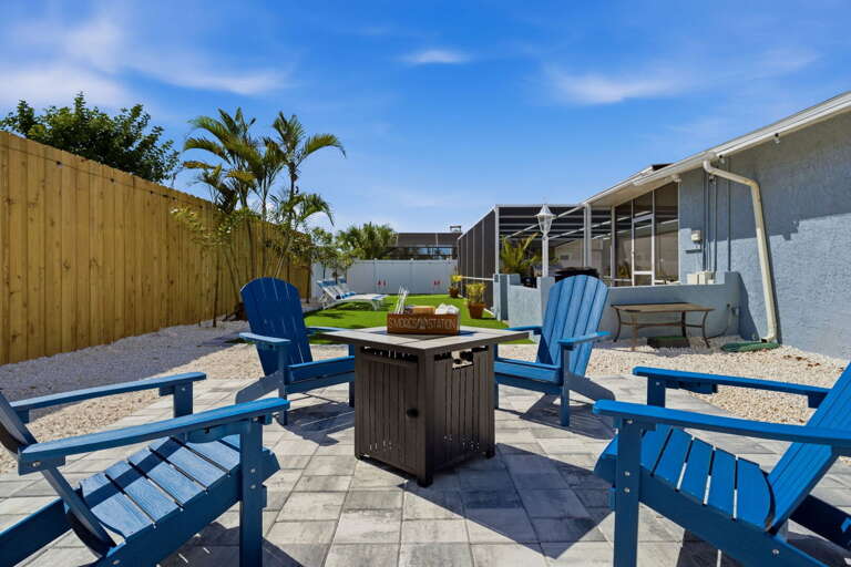 Kick back in the Adirondack chairs around the fire pit — the backyard holds the whole group comfortably night after night.