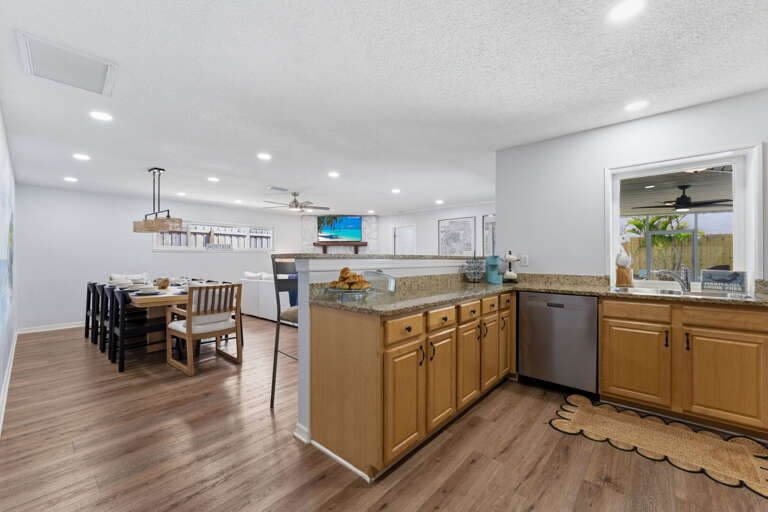 Prep dinner at the island while the group drifts in around you — the open plan means you're part of every conversation from the stovetop.