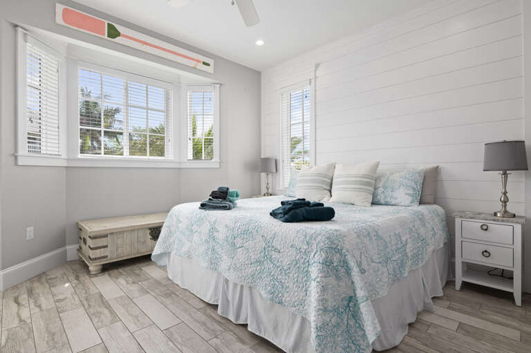 Let the bay window do the waking up for you — light through the shutters instead of an alarm, and a king bed you won't want to leave.