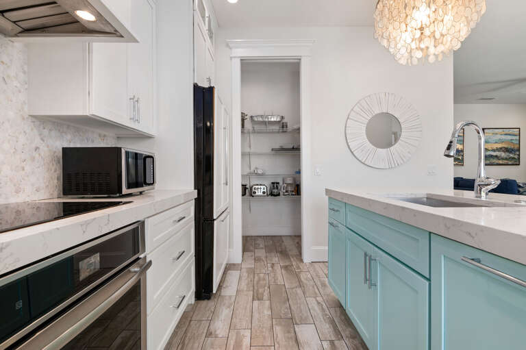 Cook breakfast for sixteen without anyone bumping elbows — this second kitchen keeps the whole group fed at the same time.