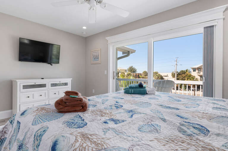 Drift off to whatever's on the wall-mounted TV and wake up to the balcony doors already letting the morning in.