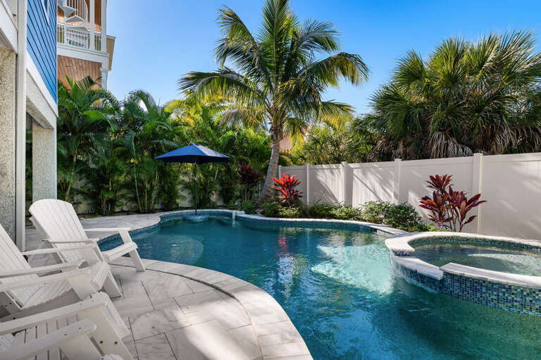 Drop straight in from the deck — the pool is steps from the back door and shaded just right for midday swims when the Gulf is calling you back.
