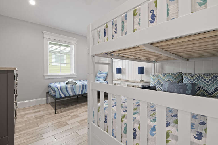 Let the kids fight over top bunk while the seahorses on the sheets settle the argument for them.