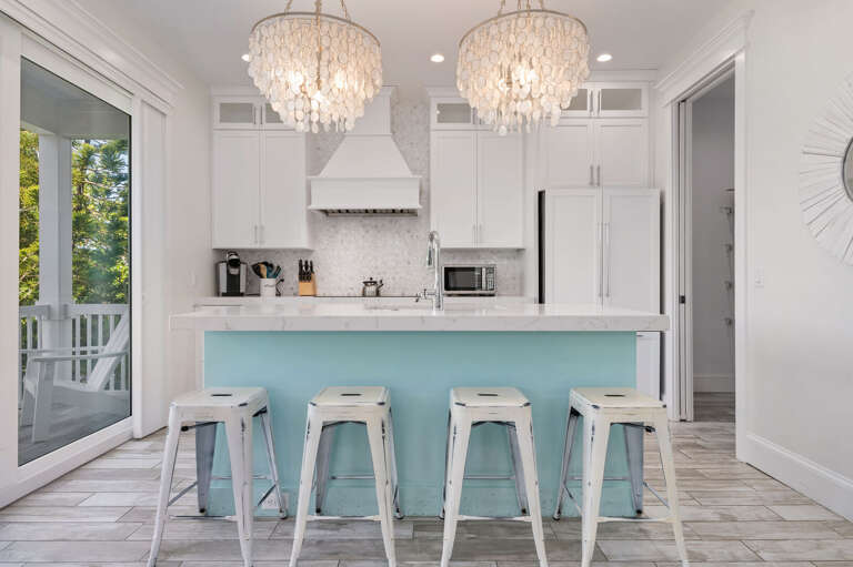 Pull up a stool at the island while dinner comes together — plenty of counter space means nobody's cooking solo on this trip.