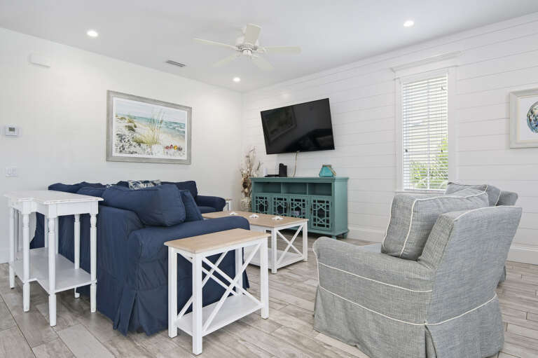 Put your feet up and let the group's movie night take over — the TV's already angled right for it, no rearranging required.