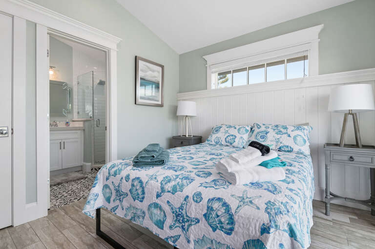 Skip the hallway line entirely — this room's ensuite is one step through that open doorway, no waiting your turn.